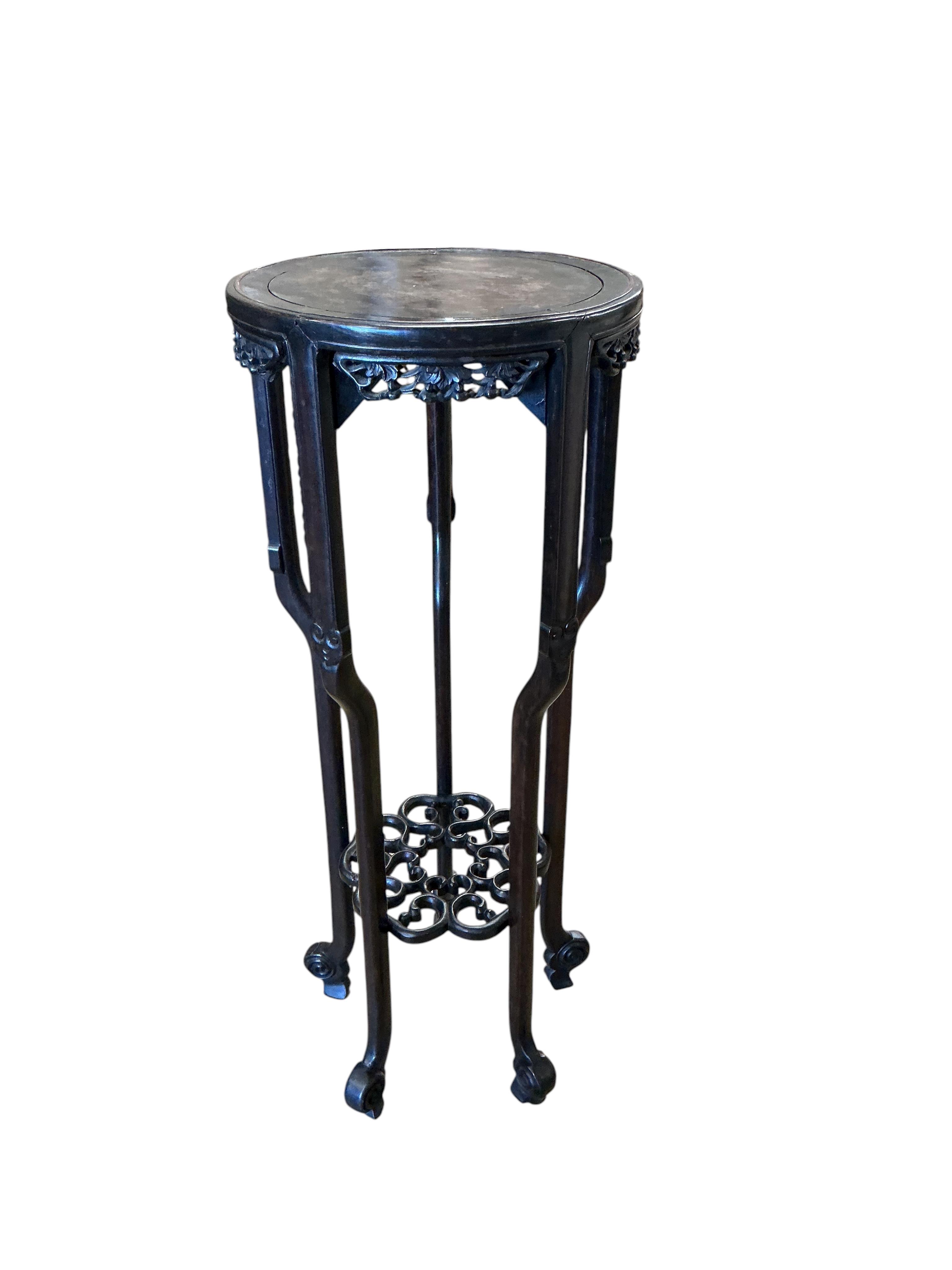 A Chinese carved hardwood vase stand, diameter 39cm, height 98cm